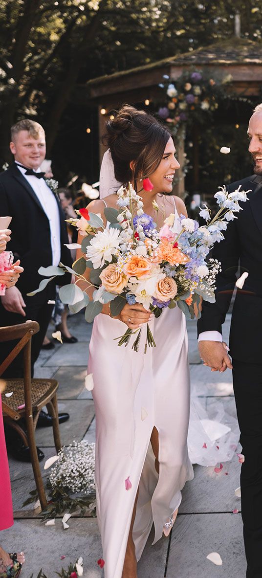 Confetti exit from Bowers Mill outdoor wedding ceremony with pastel wedding theme 