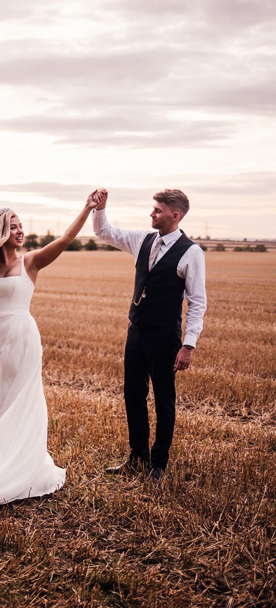 groom-spins-bride-around-for-wedding-photos