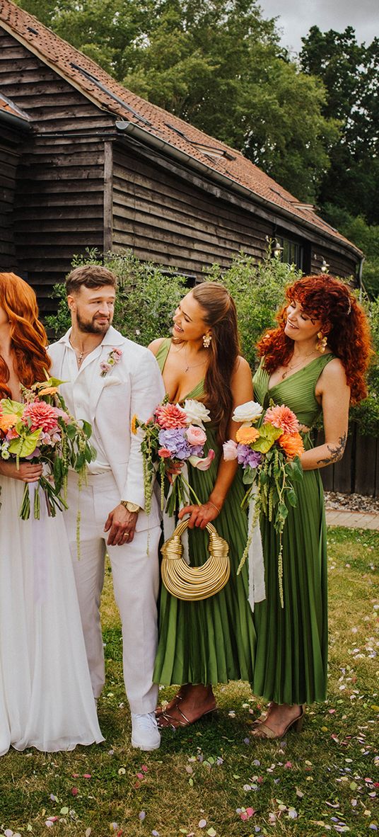 bridal-party-wearing-dark-green-pleated-bridesmaid-dresses