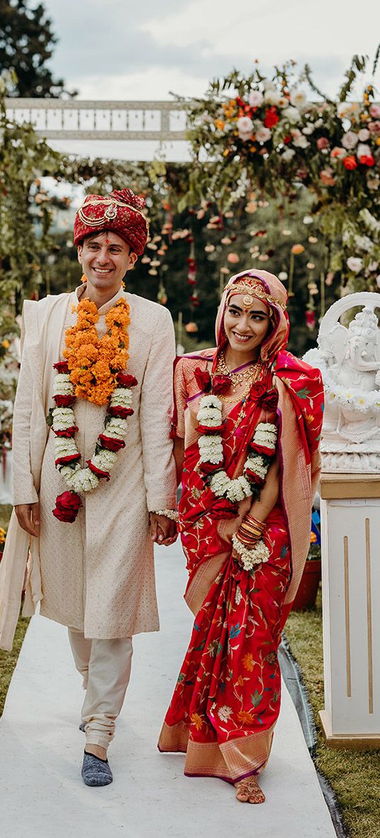 bride-and-groom-walking-back-down-the-aisle-at-hindu-wedding-ceremony-at-plas-dinam