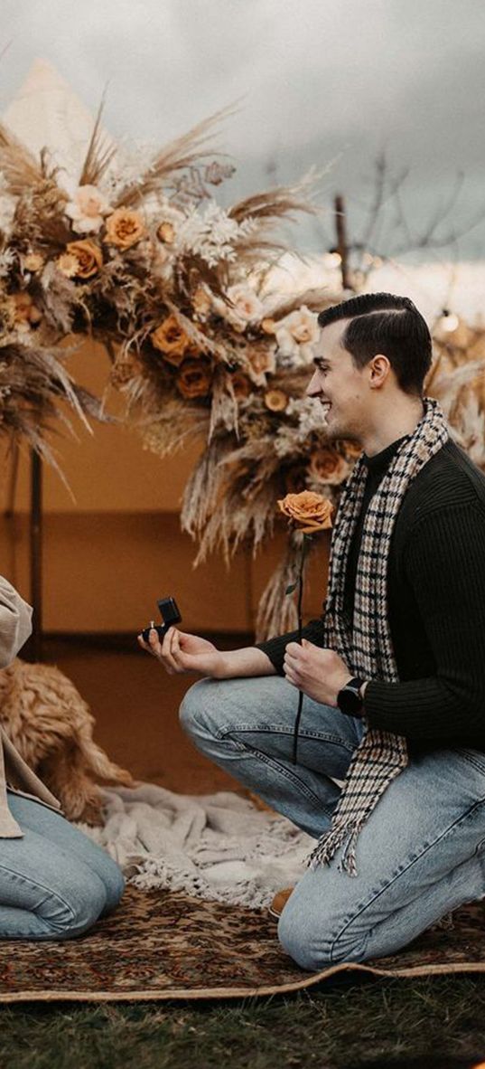 man-proposes-to-woman-in-boho-bell-tent