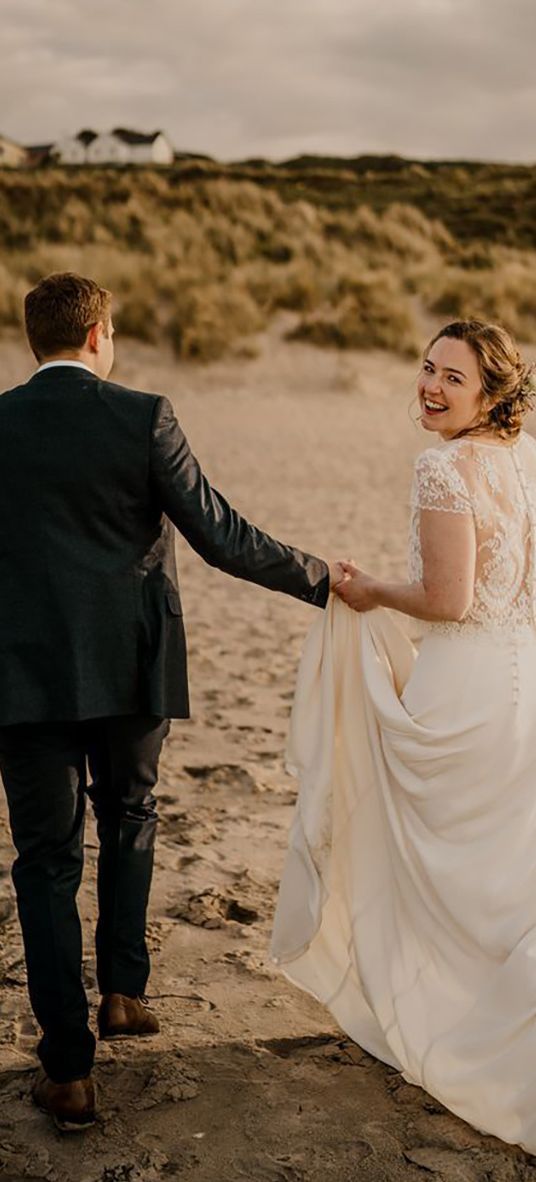 Bride in lace overlay wedding dress for coastal Irish wedding