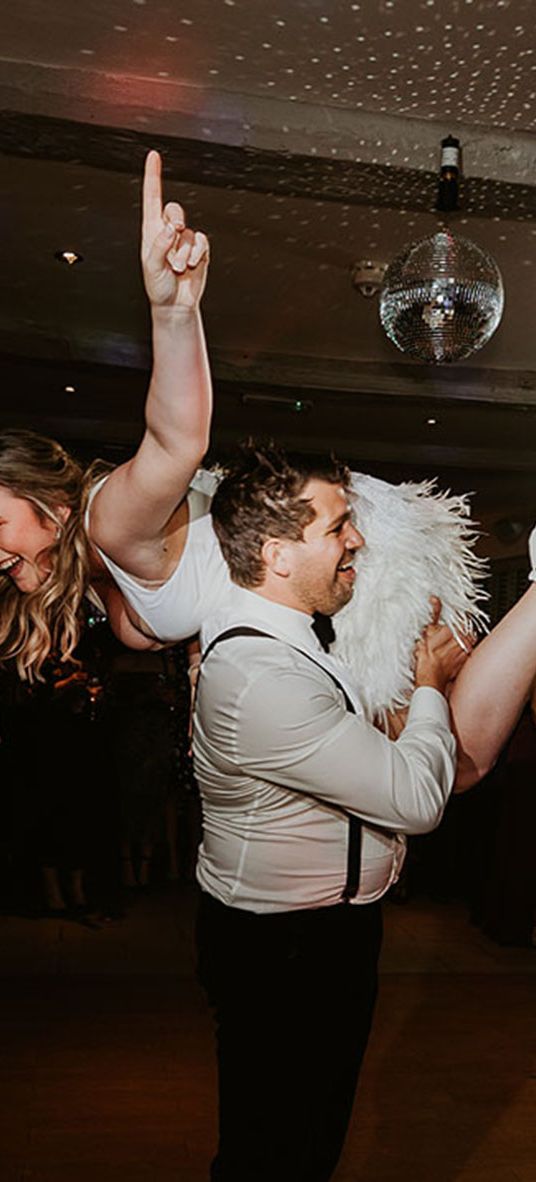 bride and groom having fun during their first dance for best oasis wedding songs