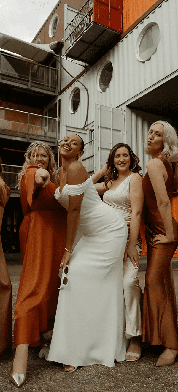 mismatched orange and neutral bridesmaid dresses for wedding colour palette 