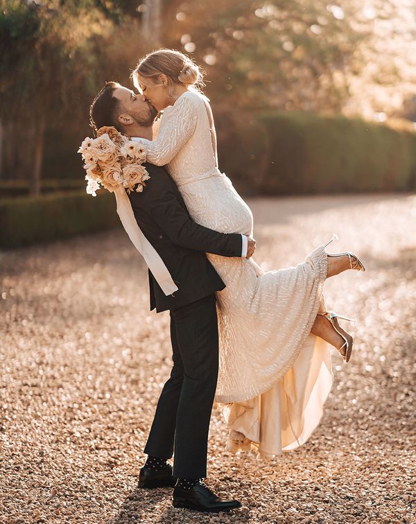 Bride and groom share a passionate and romantic kiss