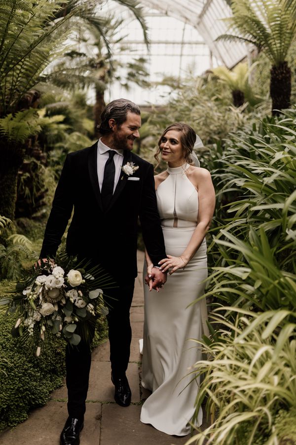 Elegant Tatton Park wedding with tropical flowers and halter neck dress