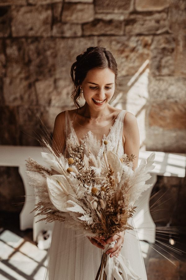 Bride with Dried Flower Wedding Bouquet