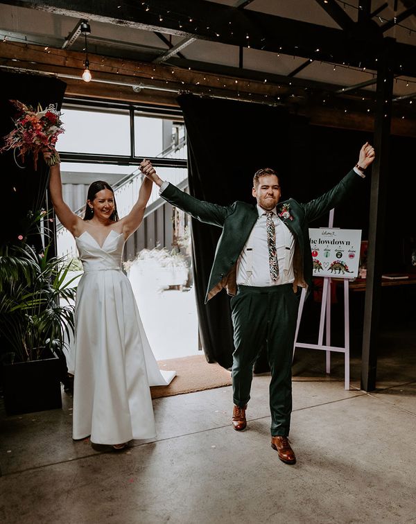 Bride and groom enter their wedding reception