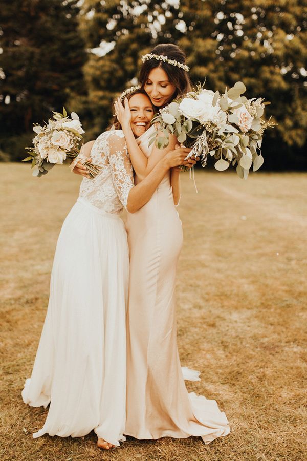 Bride and bridesmaid embracing as you can see the friendship between them