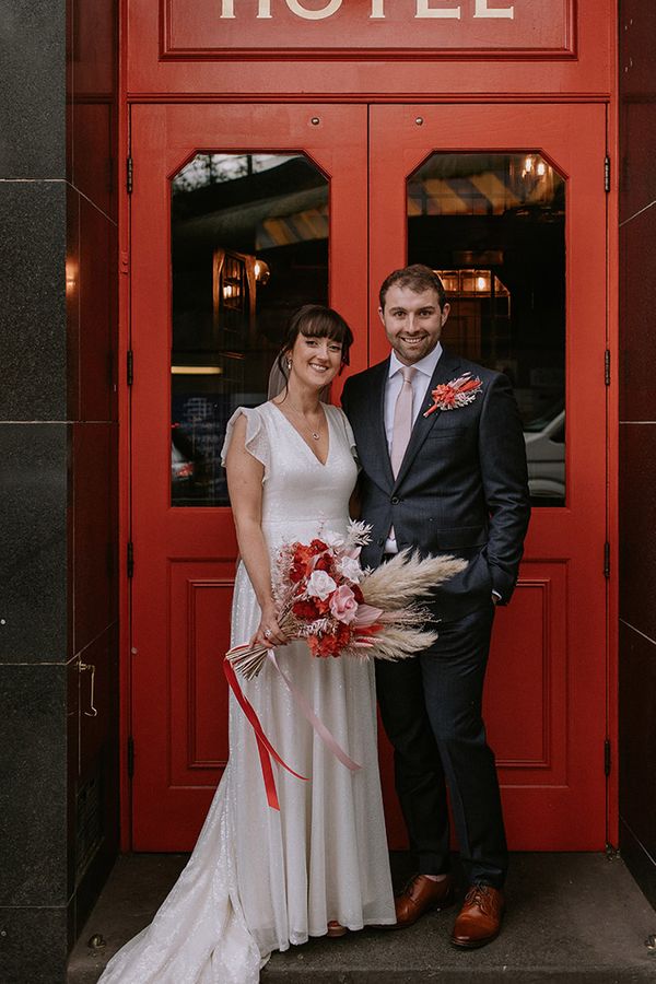 The Bedford in London wedding with bride in a sparkly wedding dress and groom in navy suit.