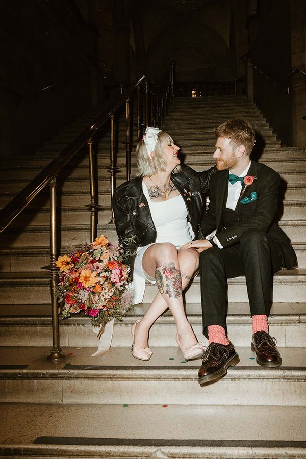 Oxford town hall wedding with bride in short wedding dress and leather jacket