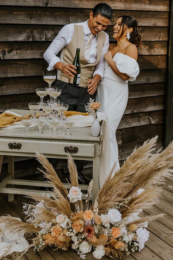 Boho wedding inspiration at The Canary Shed with a muted colour palette, drapes, macrame and wicker wedding decor by Aurora Grey Photography