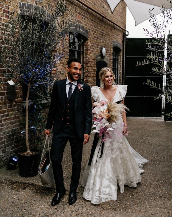 Contemporary London Wedding at The Loft Studios with Ruffle Wedding Dress by Epic Love Story