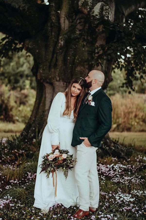 Luna Bea Bridal gown for an autumnal wedding at Elmore Court with dried flowers and rust tones 
