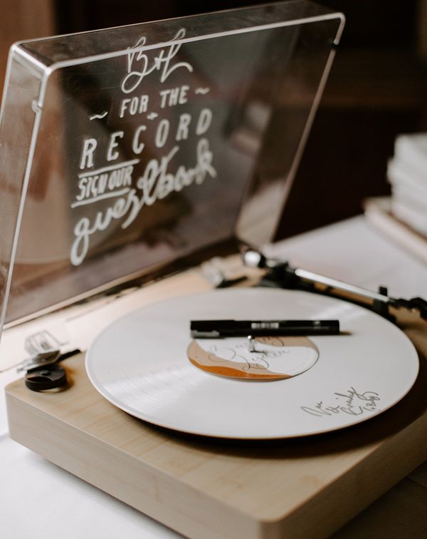 Record player alternative wedding guest book idea.