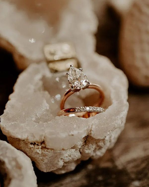 pear-shape-solitaire-diamond-engagement-ring-with-gold-band-with-wedding-band-in-crystal-ring-box