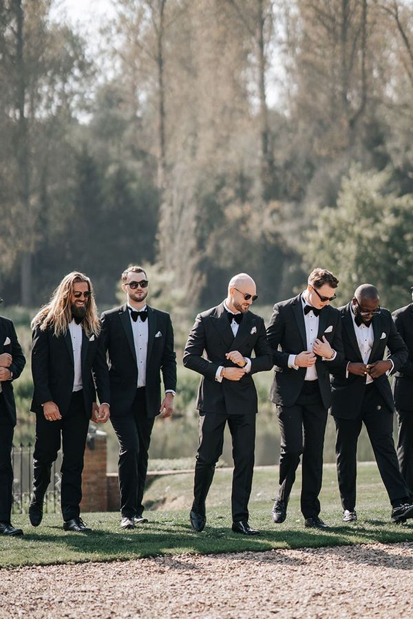 group photo of groomsmen in black-tie