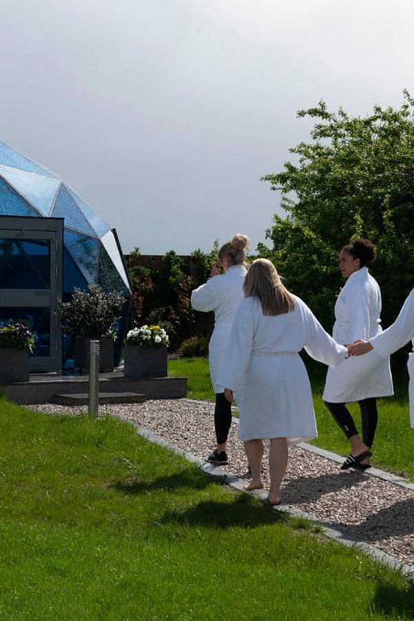 guests walking to mindfulness dome at glass house wellness retreat in essex