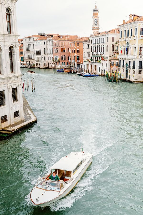 White wedding boat travelling through Venice grand canal
