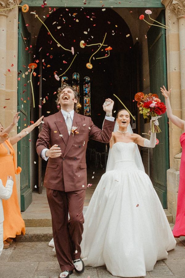 Couple's ceremony exit with real flower biodegradable confetti and stems