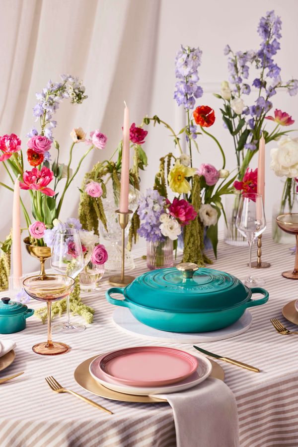 Le Creuset Bleu Riviera new cast iron casserole dish styled on a colourful wedding tablescape with pastel florals, glassware and modern table decor