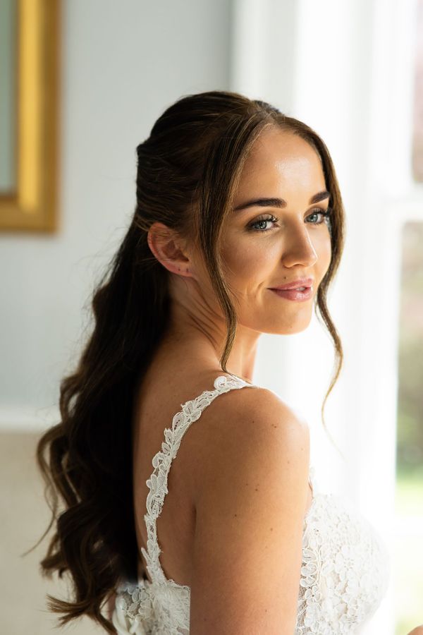 Bride with glowy skin on wedding morning