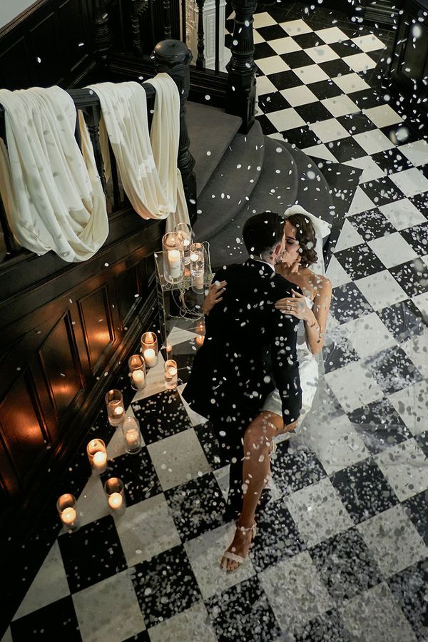 bride and groom confetti aerial shot kiss in vegas inspired editorial shoot