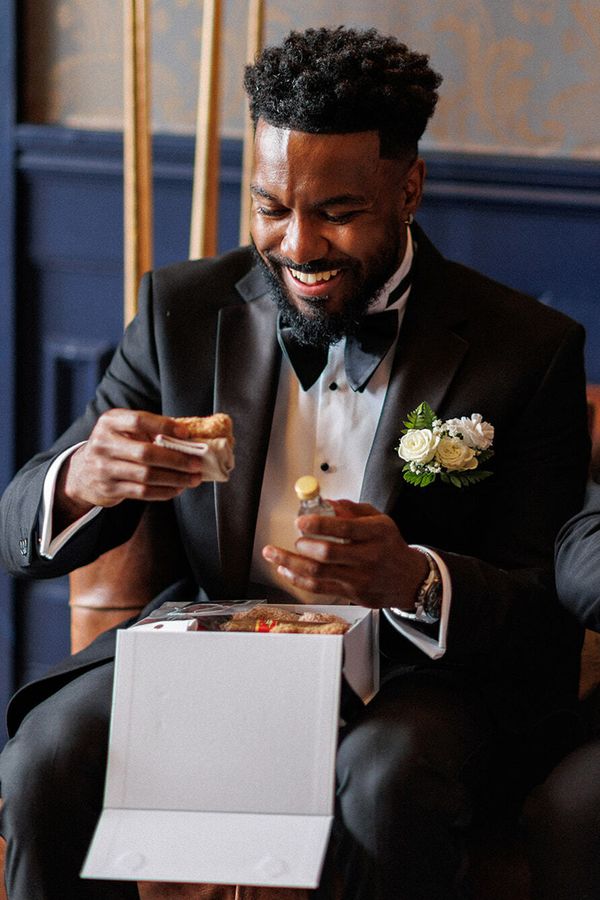 Groomsmen gift box unboxing on wedding morning