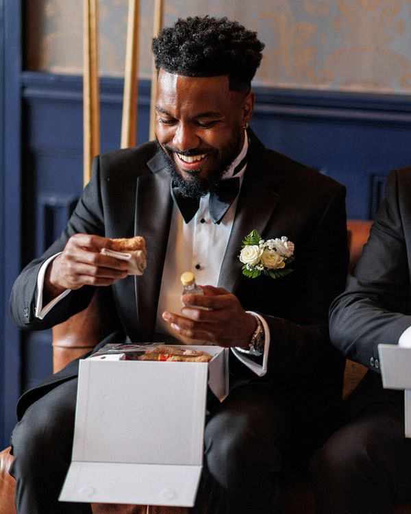 Groomsmen gift box unboxing on wedding morning