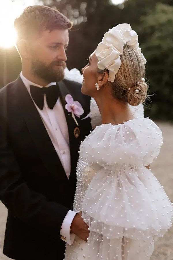 bride-with-pearl-puff-sleeves-with-groom-at-golden-hour
