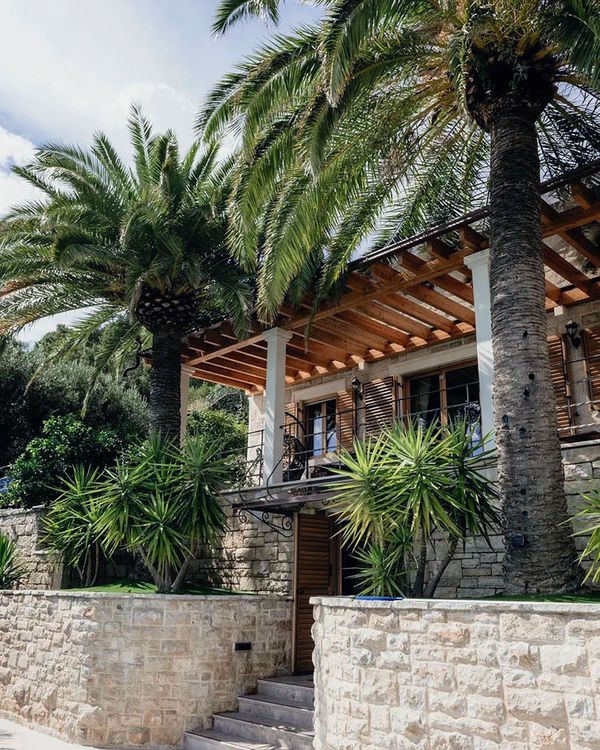 Exterior of Villa Dalmacija in Croatia with palm tress for 2026 honeymoon