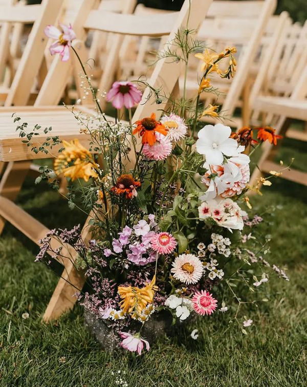 spring wedding flowers meadow aisle arrangement
