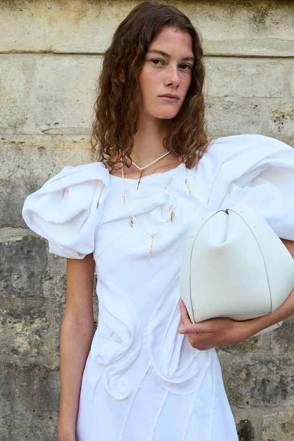 Gabriela Hearst designer sustainable wedding dress with puff sleeves in ivory linen