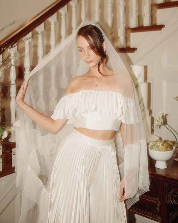 Two piece wedding dress with bardot crop top and pleated maxi skirt