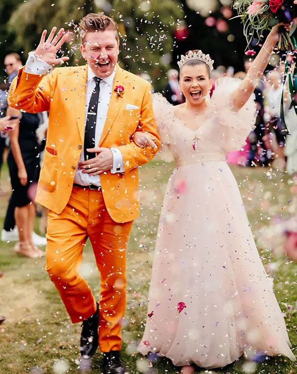 groom wearing colourful, unique mustard orange groom on wedding day