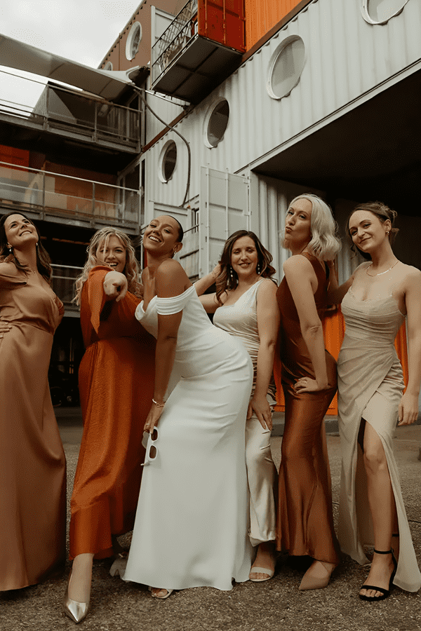 mismatched orange and neutral bridesmaid dresses for wedding colour palette 