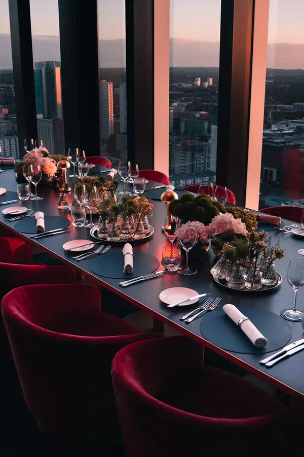 orelle rehearsal dinner private room table set up with floor to ceiling windows