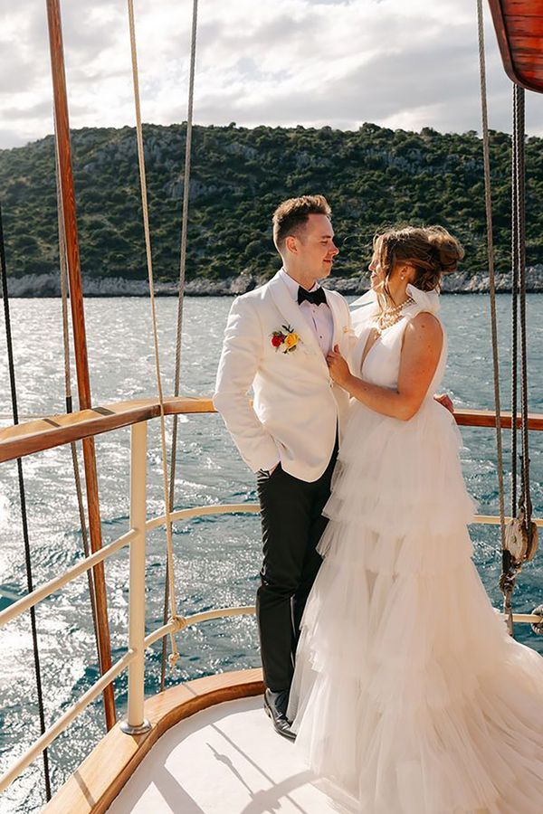 Bride and groom posing for picture at boat wedding in Split