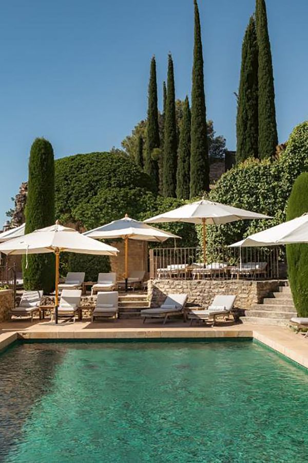 Pool area of luxury hotel in restored village in Provence for minimoon