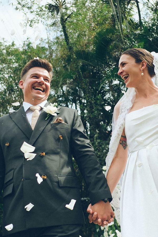 Couple who used Gather holding hands on their wedding day