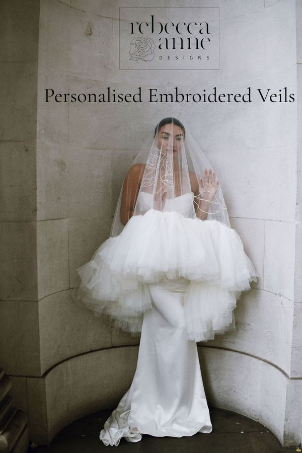 A modern bride wearing a drop wedding veil with a ruffled tulle edge and personalised embroidery by Rebecca Anne Designs, captured by Scarlett Cook Photography.