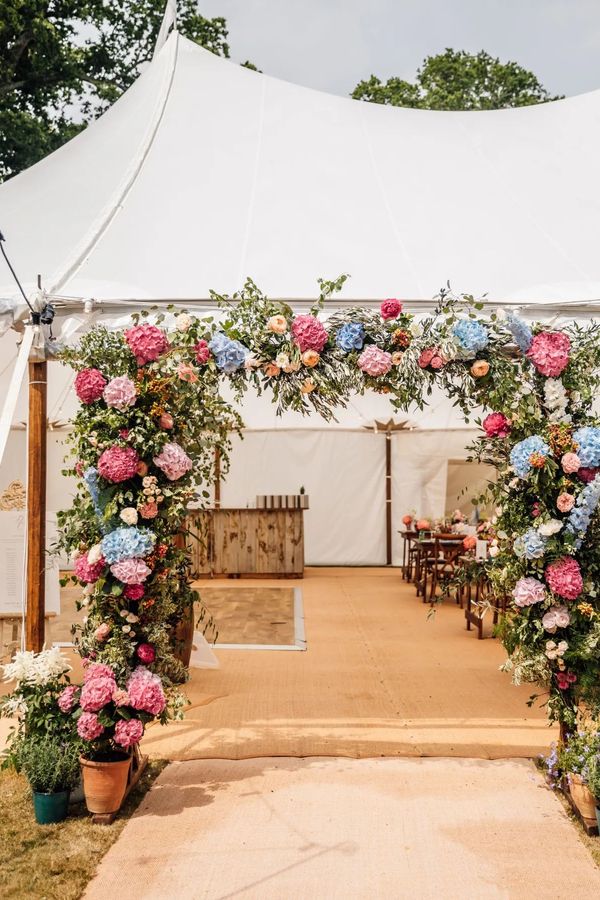 Vibrant Summer Marquee Entrance. Photographer: Stephanie and Nicole Wedding Photography