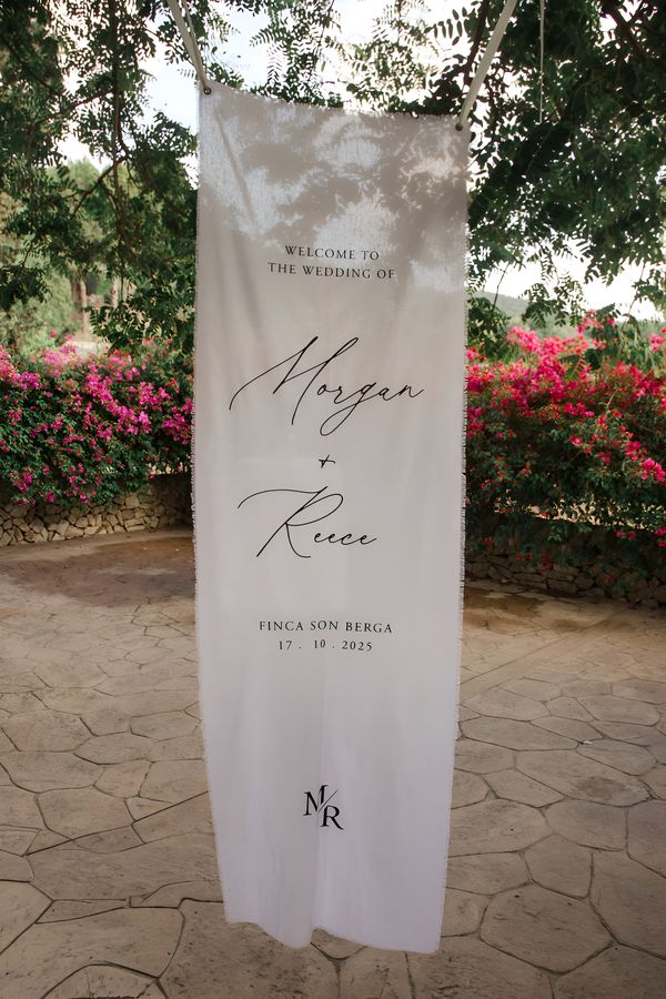 Fabric Wedding Welcome Banner. Photo by Humà 06 Photos and Cinema. Design by Paper Grace.