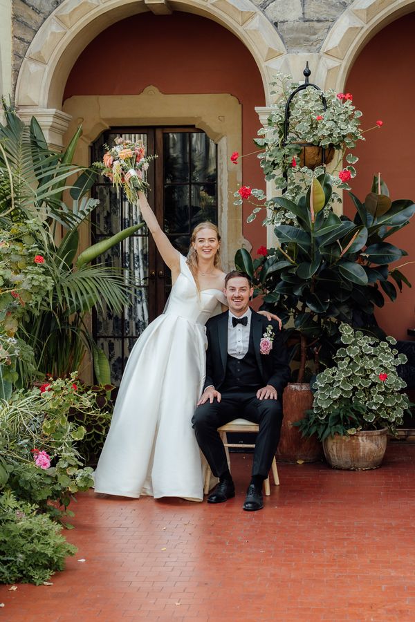 Caitlin & Kevin couple's portrait in the stunning conservatory at Clevedon Hall by Just James Weddings