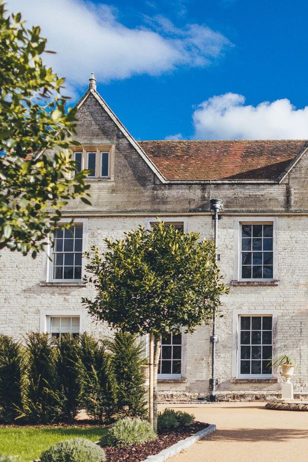 Froyle Park manor house exterior with blue sky