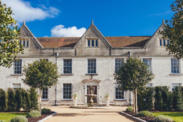 Froyle Park manor house exterior with blue sky