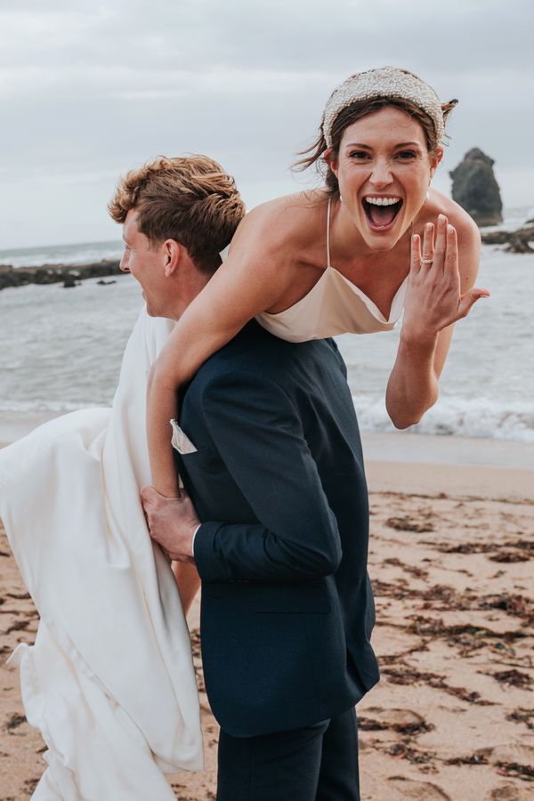 Bride and Groom celebrating saying I do on Devon Beach - South Milton