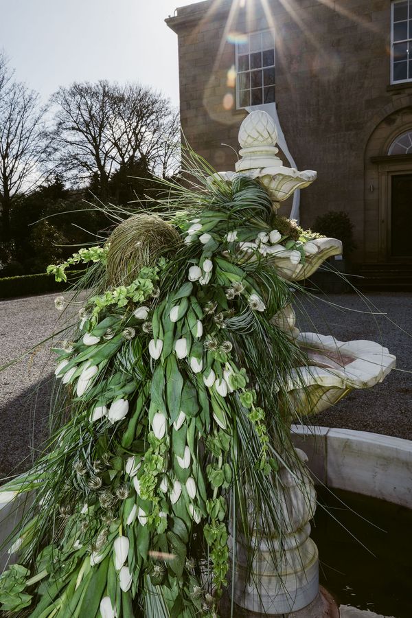 A non-working fountain brought back to life through flowers . Photo credit @paulinaharstonphotography 
