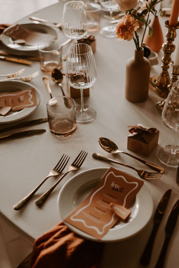 Scrumptious, warm, late summer wedding tablescape. Photograph by Louise Anna Photography.