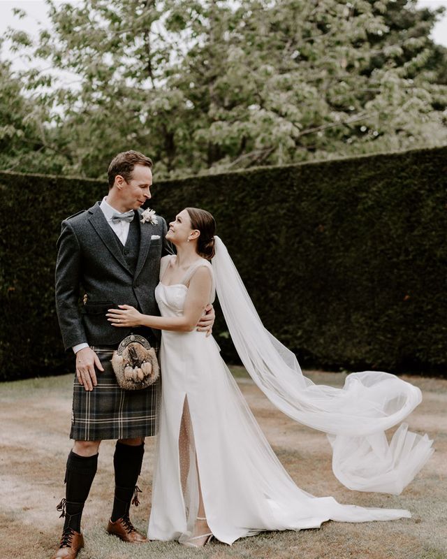 Pimhill Barn wedding with the groom in a kilt and bride in sparkly wedding dress.
